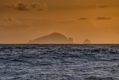 St Kilda silhouetted in the setting sun - Photo : George Stoyle.