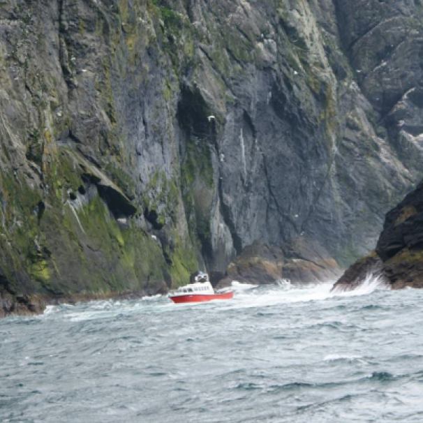 St Kilda boat and cliffs ©Marjorie Wilson